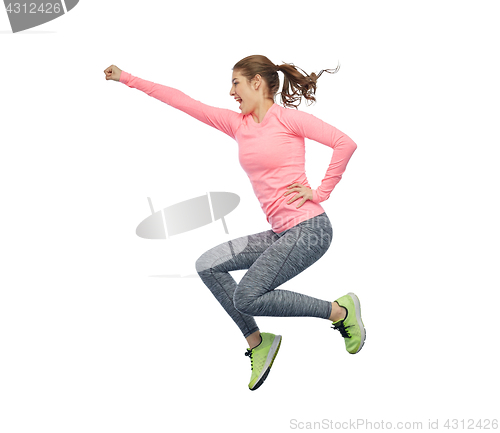 Image of happy smiling sporty young woman jumping in air