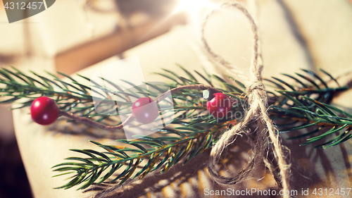 Image of close up of christmas gift with fir brunch