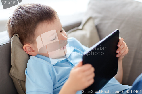 Image of little boy with tablet pc computer at home