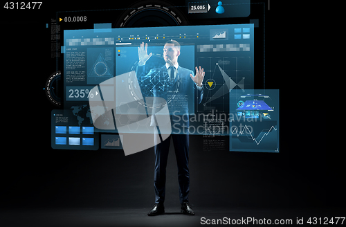 Image of businessman in suit with virtual projection