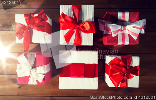 Image of close up of gift boxes on wooden floor from top