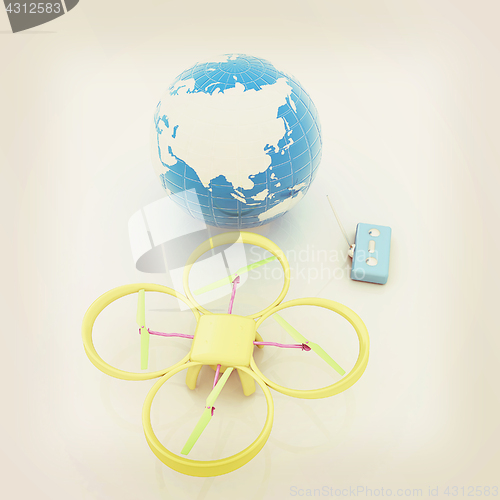 Image of Quadrocopter Drone with Earth Globe and remote controller on a w