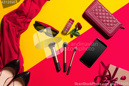 Image of Still life of fashion woman, objects on yellow table