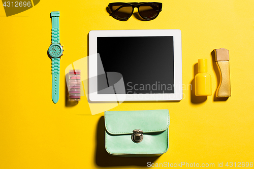 Image of Still life of fashion woman, objects on yellow