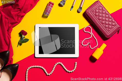 Image of Still life of fashion woman, objects on yellow table