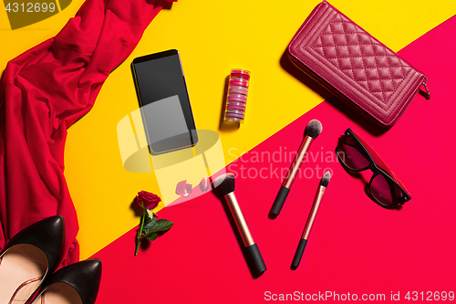 Image of Still life of fashion woman, objects on yellow table