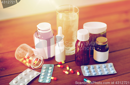 Image of medicine and drugs on wooden table