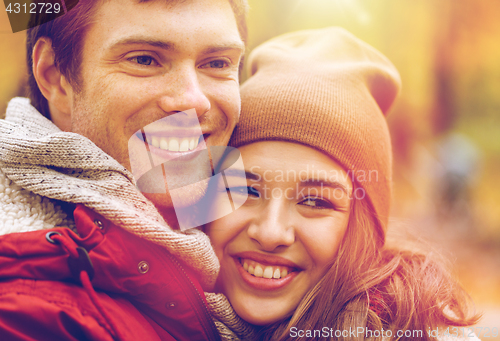 Image of close up of happy young couple in autumn park