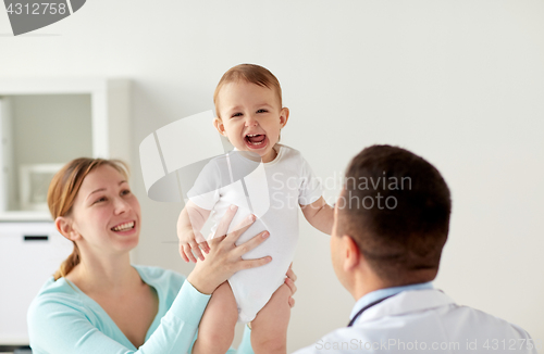 Image of happy woman with baby and doctor at clinic