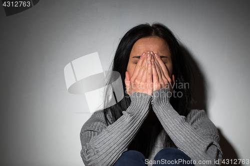 Image of sad crying woman suffering from domestic violence