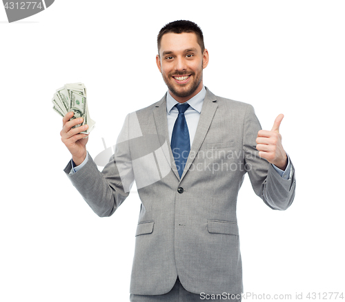 Image of smiling businessman with american dollar money