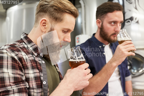 Image of men testing non-alcoholic craft beer at brewery