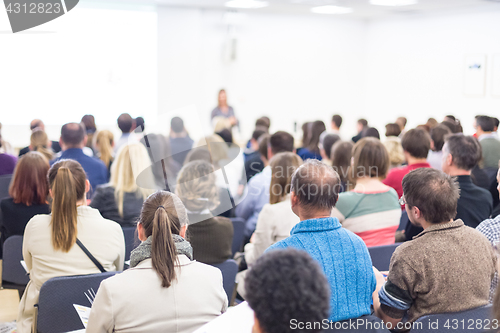 Image of Woman giving presentation on business conference.