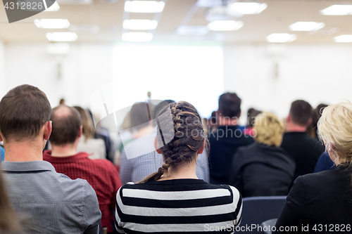 Image of Woman giving presentation on business conference.