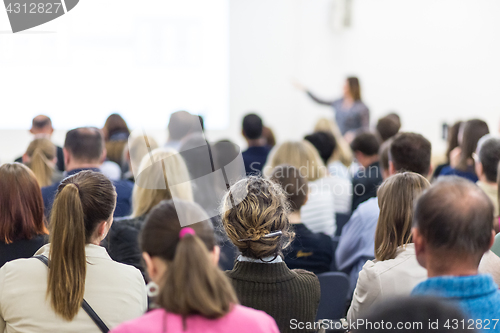 Image of Woman giving presentation on business conference.