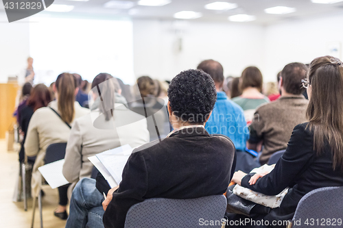 Image of Woman giving presentation on business conference.