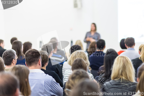 Image of Woman giving presentation on business conference.