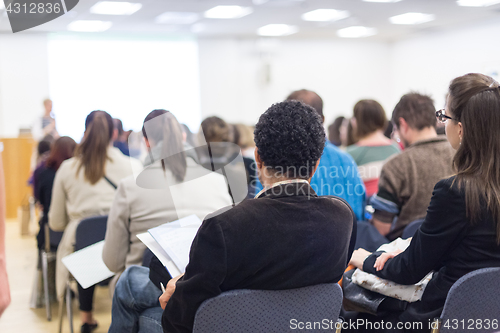 Image of Woman giving presentation on business conference.