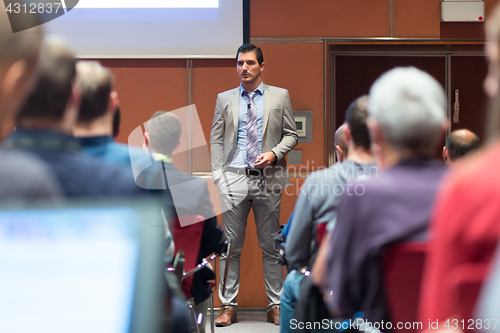 Image of Speaker Giving a Talk at Business Meeting.