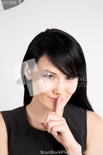 Image of Businesswoman shushing