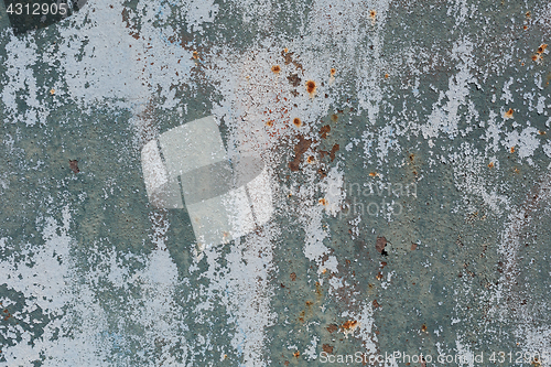 Image of Rusty metal surface with blue paint