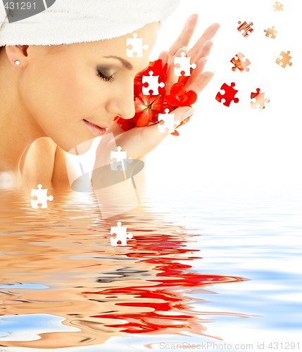 Image of lady with red petals in water