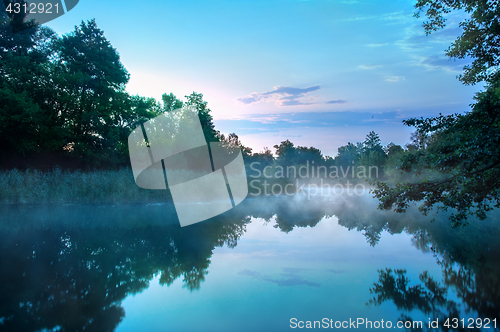 Image of Morning fog on a calm river