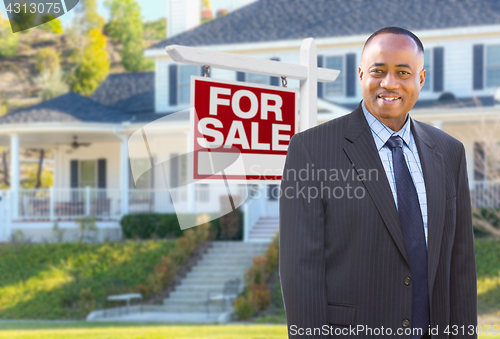 Image of African American Agent In Front of Beautiful Custom House and Fo
