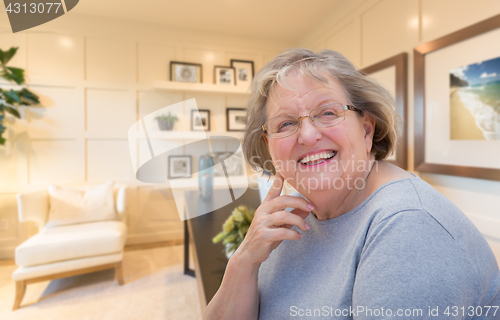 Image of Senior Woman Inside Her Home Office.