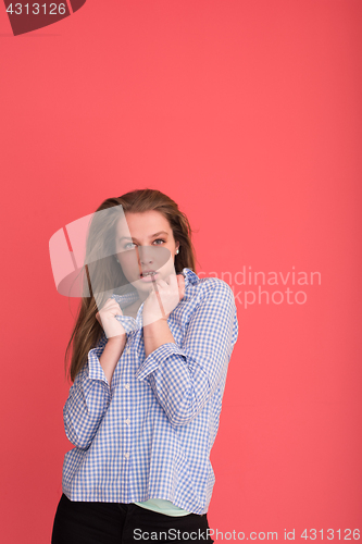 Image of woman playing with her long silky hair