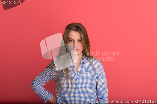 Image of woman playing with her long silky hair