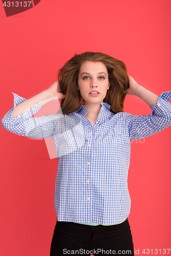 Image of woman playing with her long silky hair