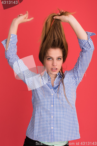 Image of woman playing with her long silky hair