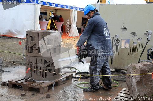 Image of Man Cuts Concrete with ICS Chain Saw