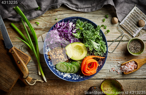 Image of Vegan bowl on wooden table