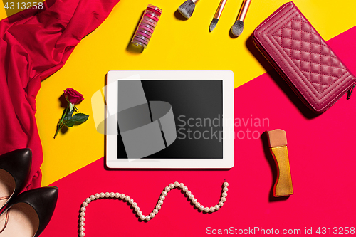 Image of Still life of fashion woman, objects on yellow table