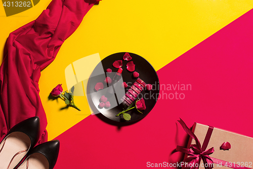 Image of Still life of fashion woman, objects on yellow table