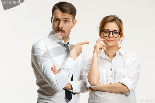 Image of The business man and woman communicating on a gray background