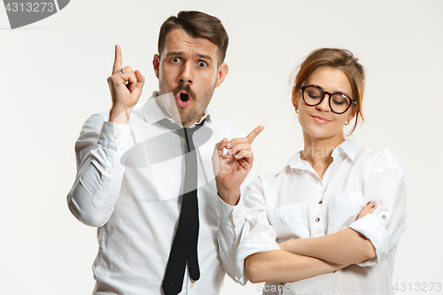 Image of The business man and woman communicating on a gray background