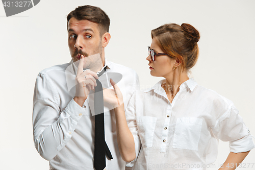 Image of The business man and woman communicating on a gray background