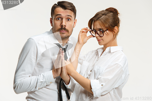 Image of The business man and woman communicating on a gray background