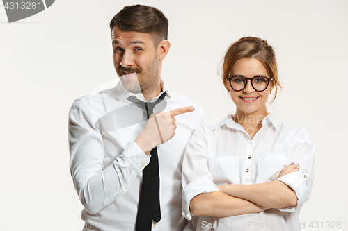 Image of The business man and woman communicating on a gray background