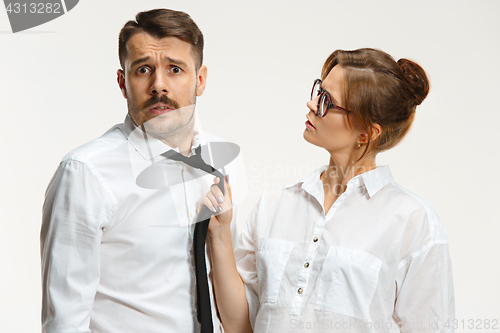 Image of The business man and woman communicating on a gray background