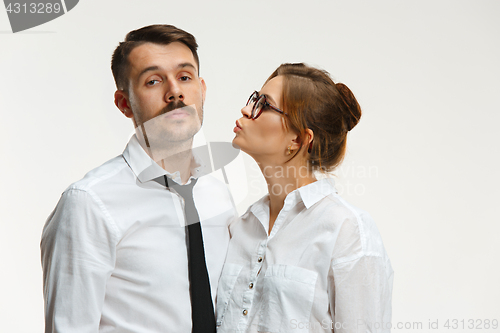 Image of The business man and woman communicating on a gray background