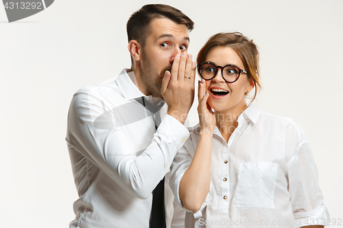 Image of The business man and woman communicating on a gray background