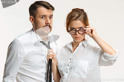 Image of The business man and woman communicating on a gray background