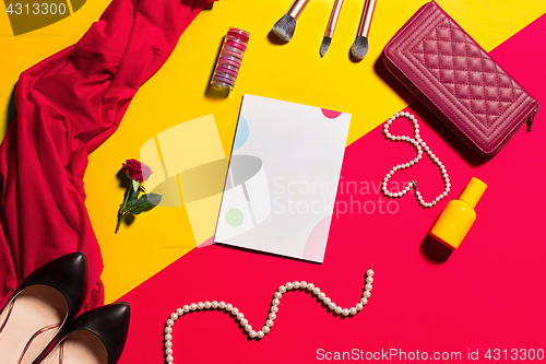 Image of Still life of fashion woman, objects on yellow table