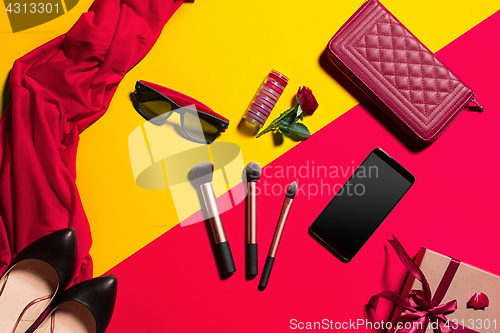 Image of Still life of fashion woman, objects on yellow table