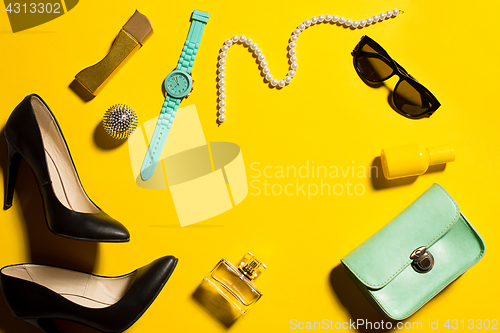 Image of Still life of fashion woman, objects on yellow