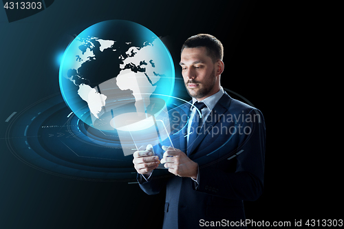 Image of businessman with tablet pc and virtual globe